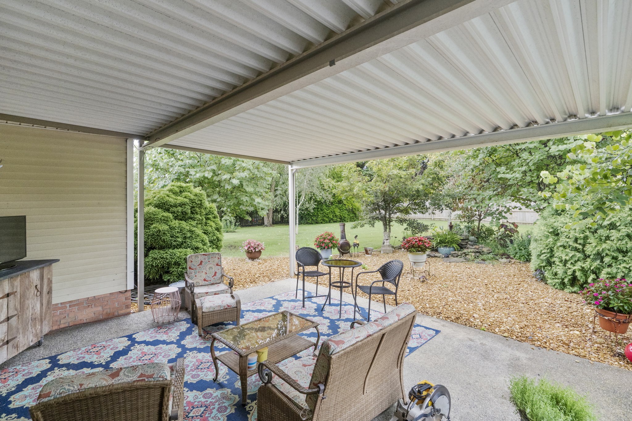 7313 West Cook Road Springfield, TN 37172 - Photo 36 of 40 a living room with patio furniture and a floor to ceiling window