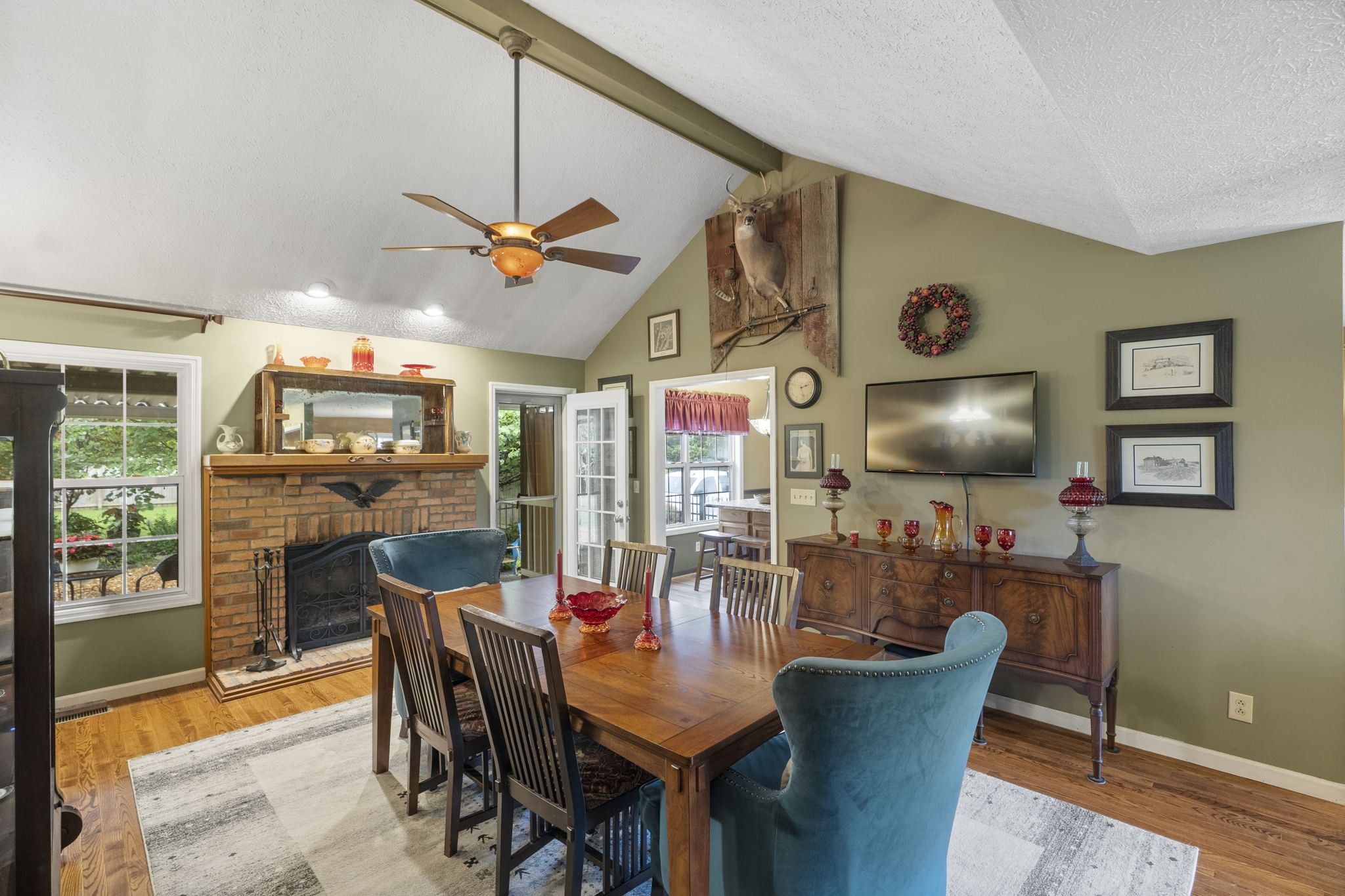 7313 West Cook Road Springfield, TN 37172 - Photo 6 of 40 a dining room with furniture a window and a chandelier