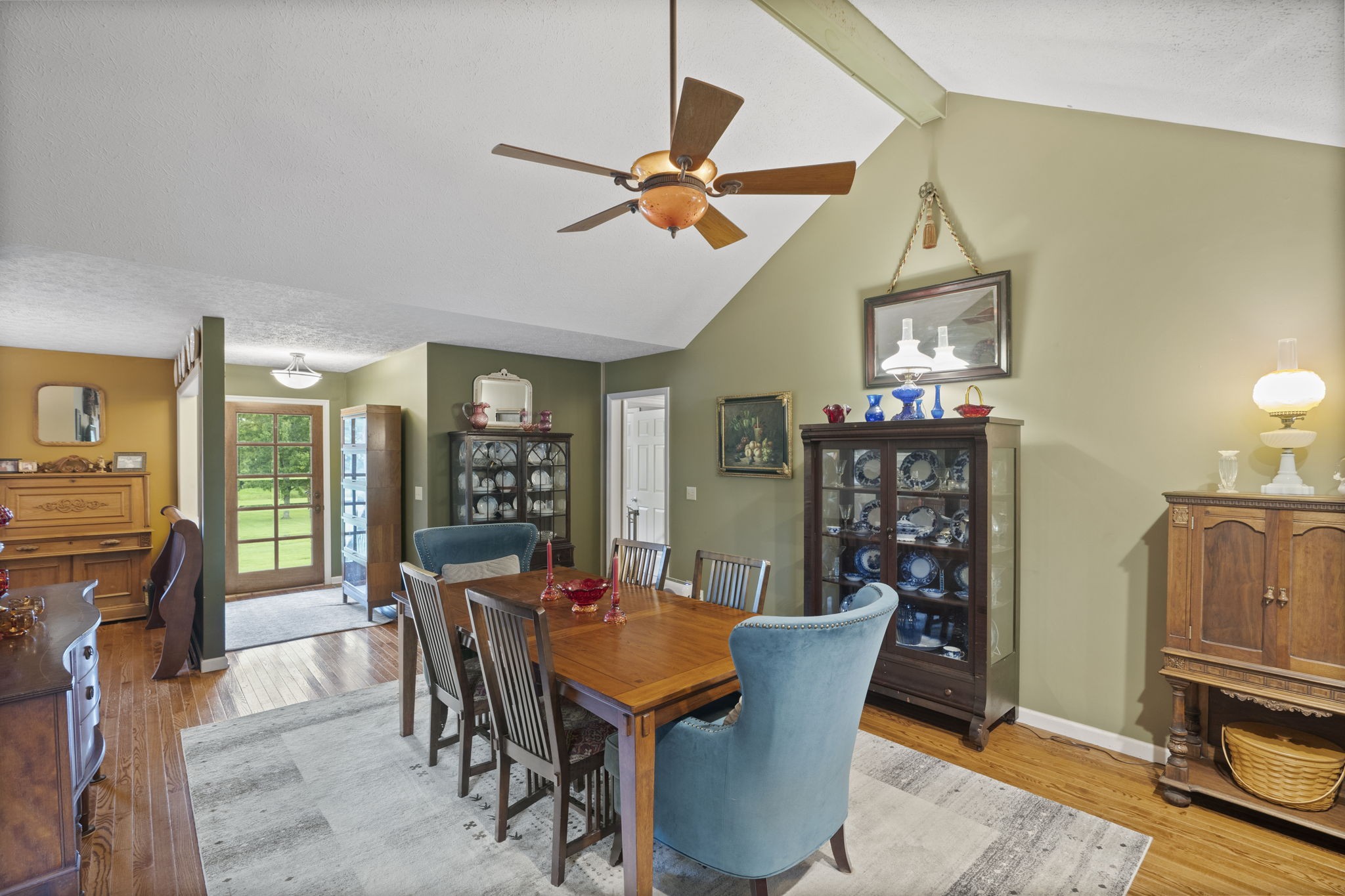 7313 West Cook Road Springfield, TN 37172 - Photo 7 of 40 a dining room with furniture a rug and chandelier