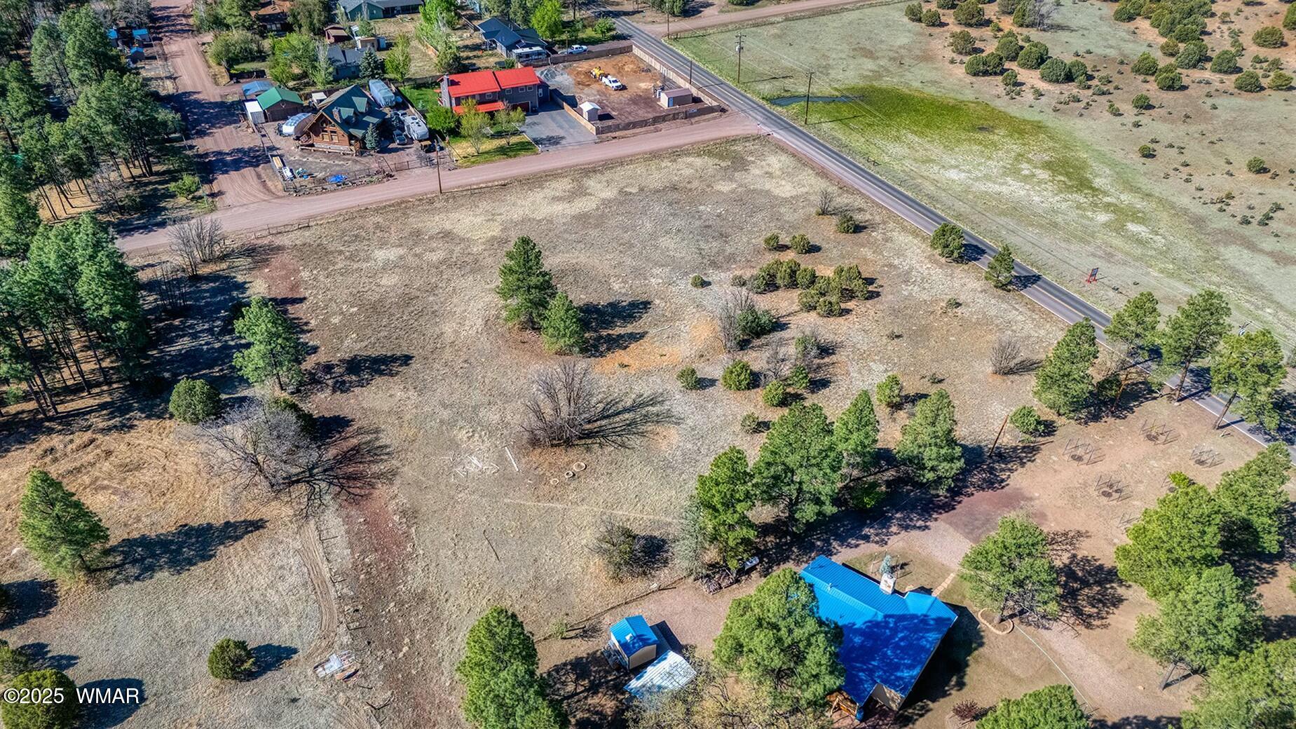 Xxx Larson Road Lakeside, AZ 85929 - Photo 44 of 45 an aerial view of a house with a yard and a wooden fence