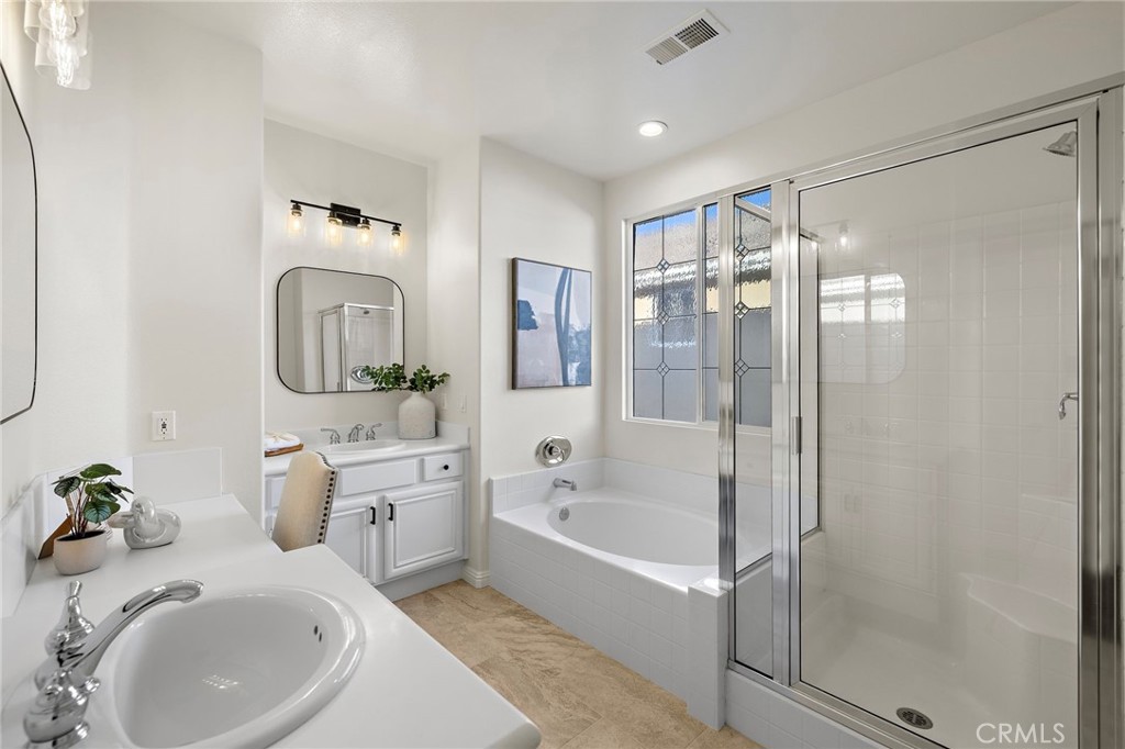 9 Paverstone Lane Ladera Ranch, CA 92694 - Photo 18 of 51 a bathroom with a tub sink and mirror