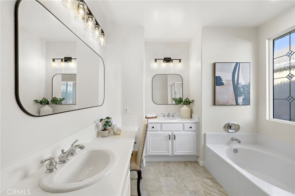 9 Paverstone Lane Ladera Ranch, CA 92694 - Photo 19 of 51 a bathroom with a tub sink and mirror