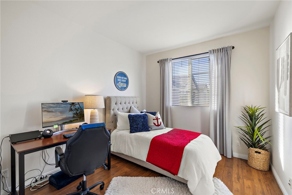 9 Paverstone Lane Ladera Ranch, CA 92694 - Photo 23 of 51 a bedroom with a bed and wooden floor