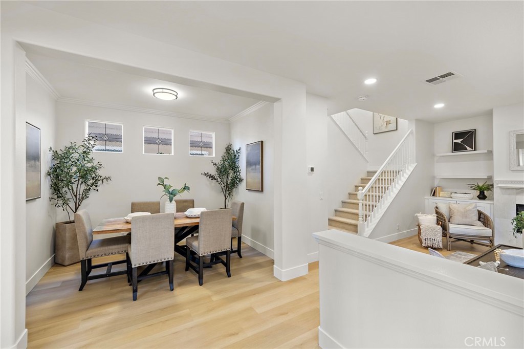 9 Paverstone Lane Ladera Ranch, CA 92694 - Photo 5 of 51 a workspace with furniture and a wooden floor