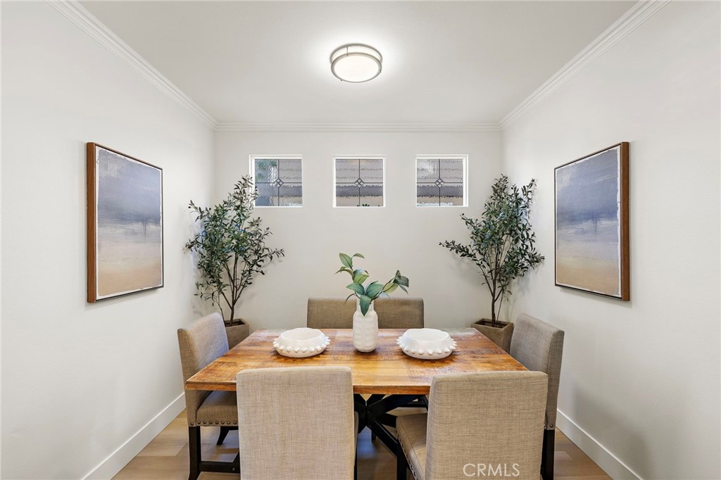 9 Paverstone Lane Ladera Ranch, CA 92694 - Photo 6 of 51 a view of a dining room with furniture and wooden floor