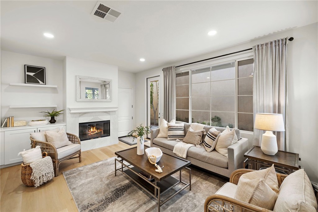 9 Paverstone Lane Ladera Ranch, CA 92694 - Photo 7 of 51 a living room with furniture and a fireplace