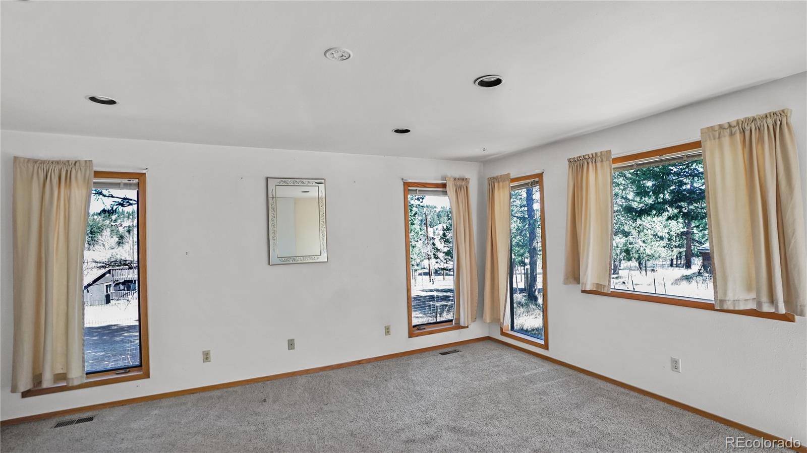 490 Quakie Way Bailey, CO 80421 - Photo 13 of 21 a view of an empty room with a window