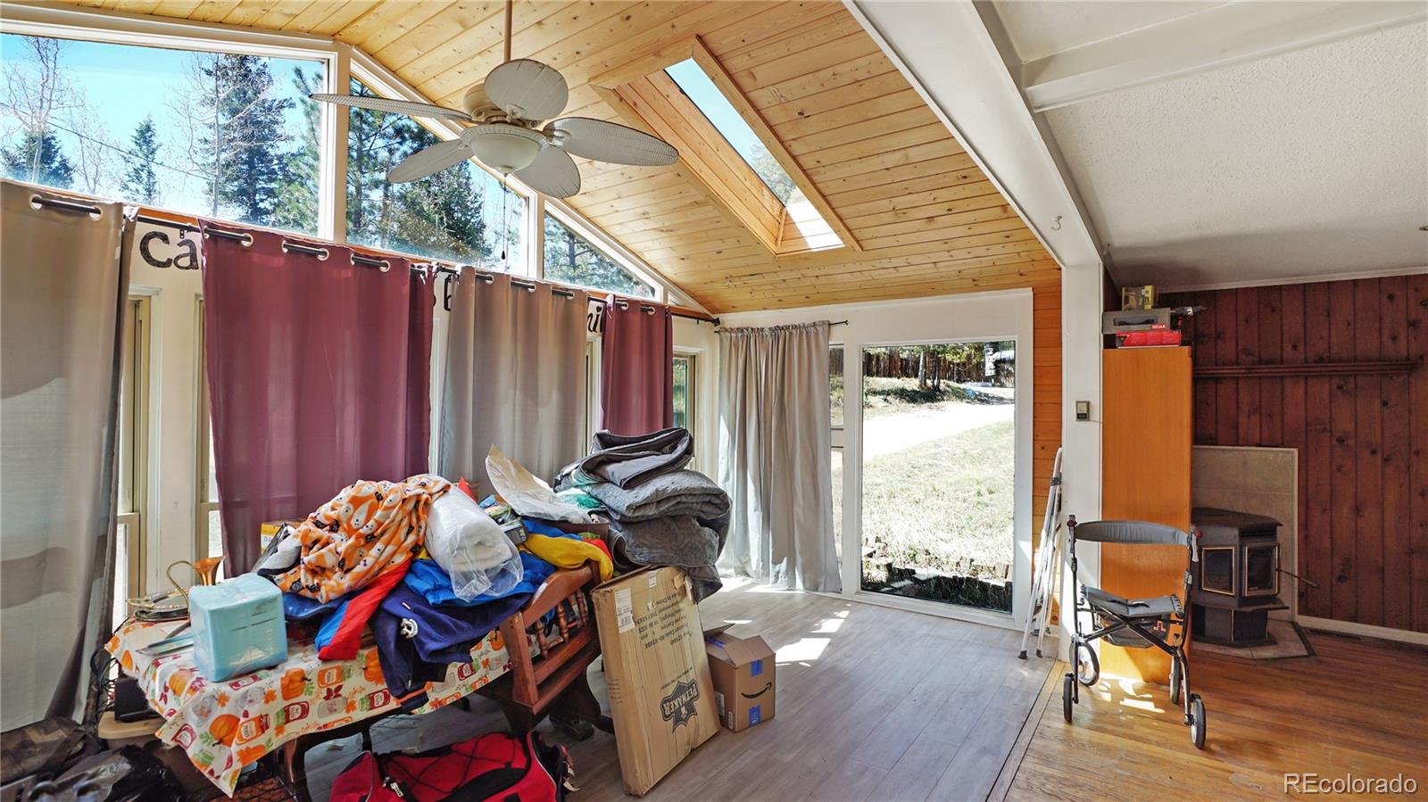 490 Quakie Way Bailey, CO 80421 - Photo 5 of 21 a backyard of a house with seating space