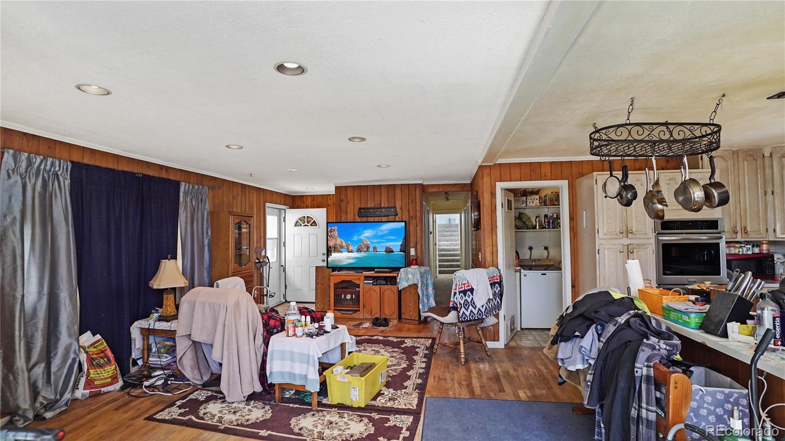 490 Quakie Way Bailey, CO 80421 - Photo 6 of 21 a living room with furniture a window and gym equipment