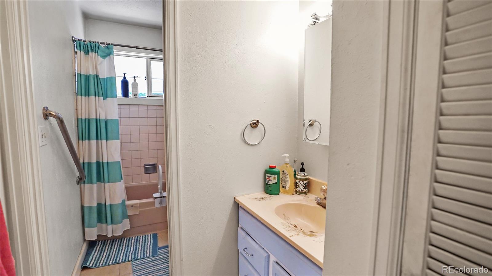 490 Quakie Way Bailey, CO 80421 - Photo 8 of 21 a bathroom with a sink and a mirror