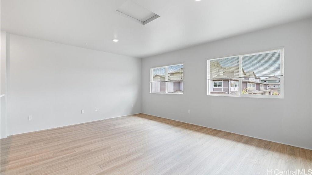 91-4099 Hikuono Street, Unit 1402 Kapolei, HI 96707 - Photo 9 of 25 an empty room with windows