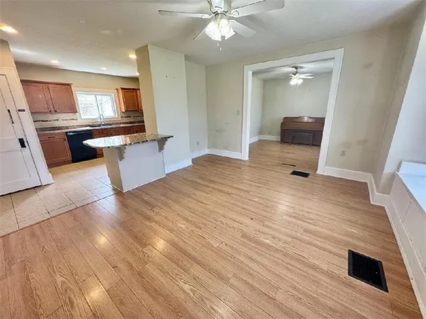 a view of a livingroom with furniture wooden floor and window