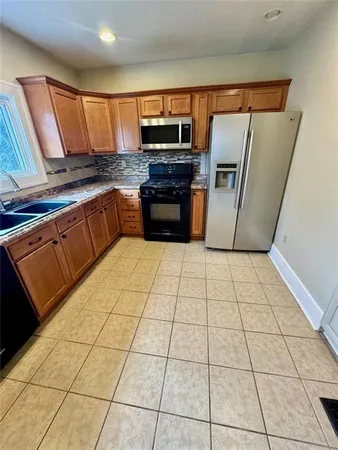 a room with wooden floor and pool table