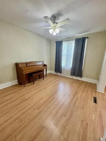 a bathroom with a sink mirror and toilet