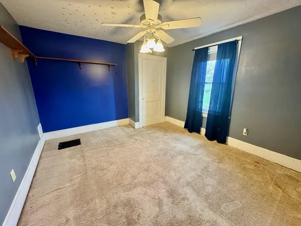 an empty room with a bathroom