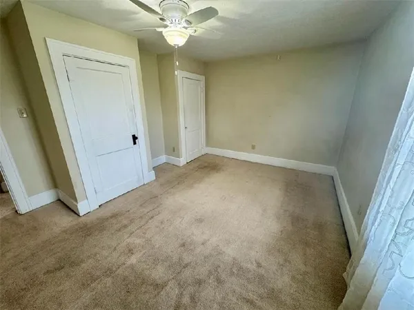 an empty room with a bathroom