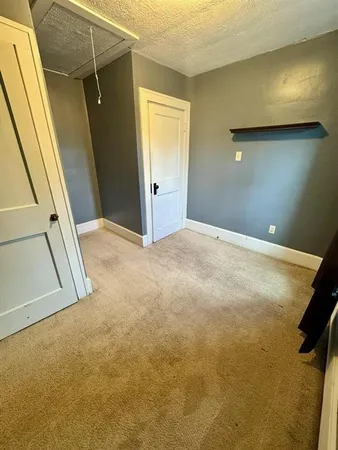 a view of room with racks on the wall