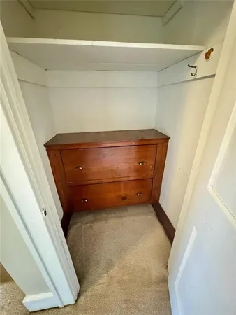 a bathroom with a sink vanity mirror and toilet