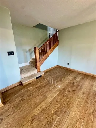 a view of a livingroom with wooden floor