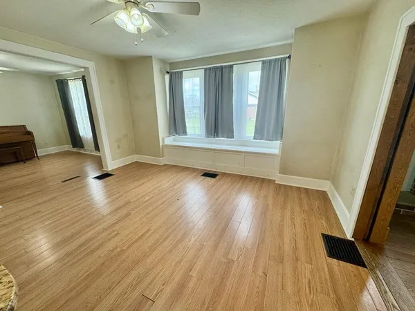 a view of a livingroom with wooden floor