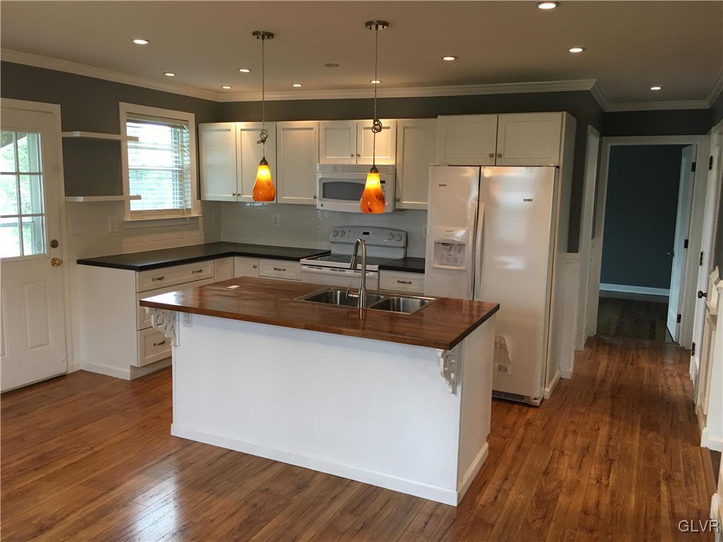 588 Bangor Road Easton, PA 18040 - Photo 4 of 24 a kitchen with stainless steel appliances granite countertop a sink a refrigerator and a microwave