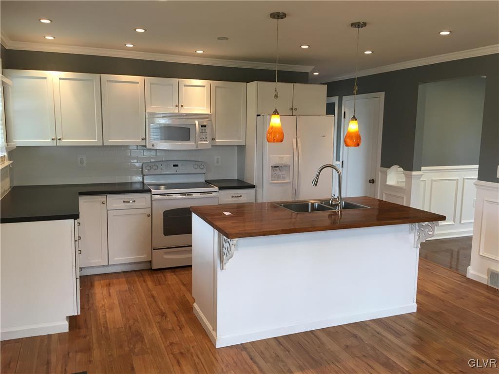 588 Bangor Road Easton, PA 18040 - Photo 5 of 24 a kitchen with stainless steel appliances granite countertop a sink a stove and a wooden floors