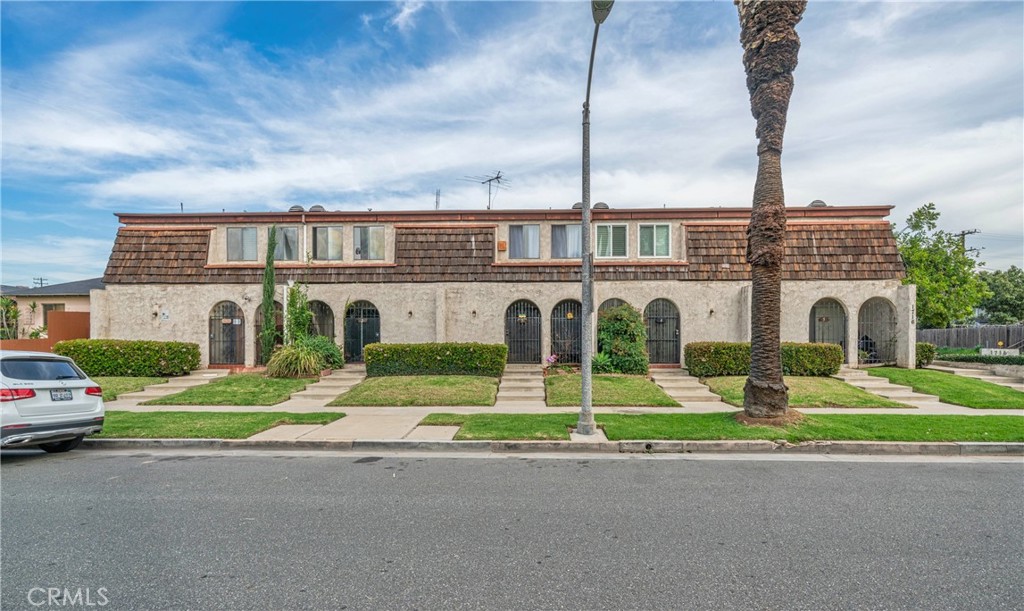 1716 South 2nd Street, Unit 6 Alhambra, CA 91801 - Photo 1 of 10 a front view of multiple houses with yard