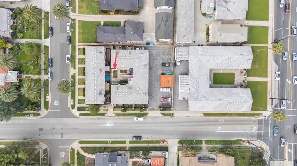 an aerial view of houses with outdoor space