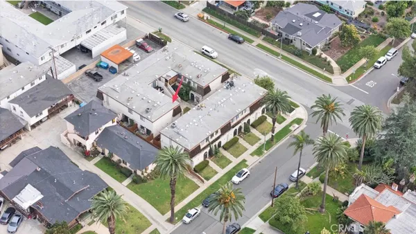 an aerial view of a house with a yard