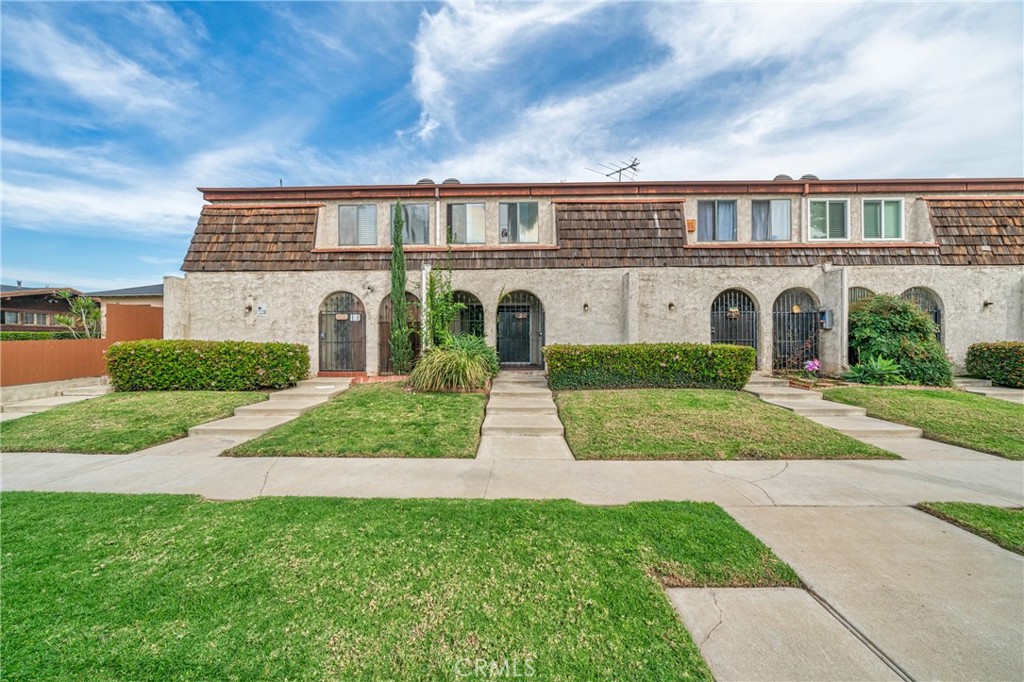 1716 South 2nd Street, Unit 6 Alhambra, CA 91801 - Photo 6 of 10 a front view of a house with a yard