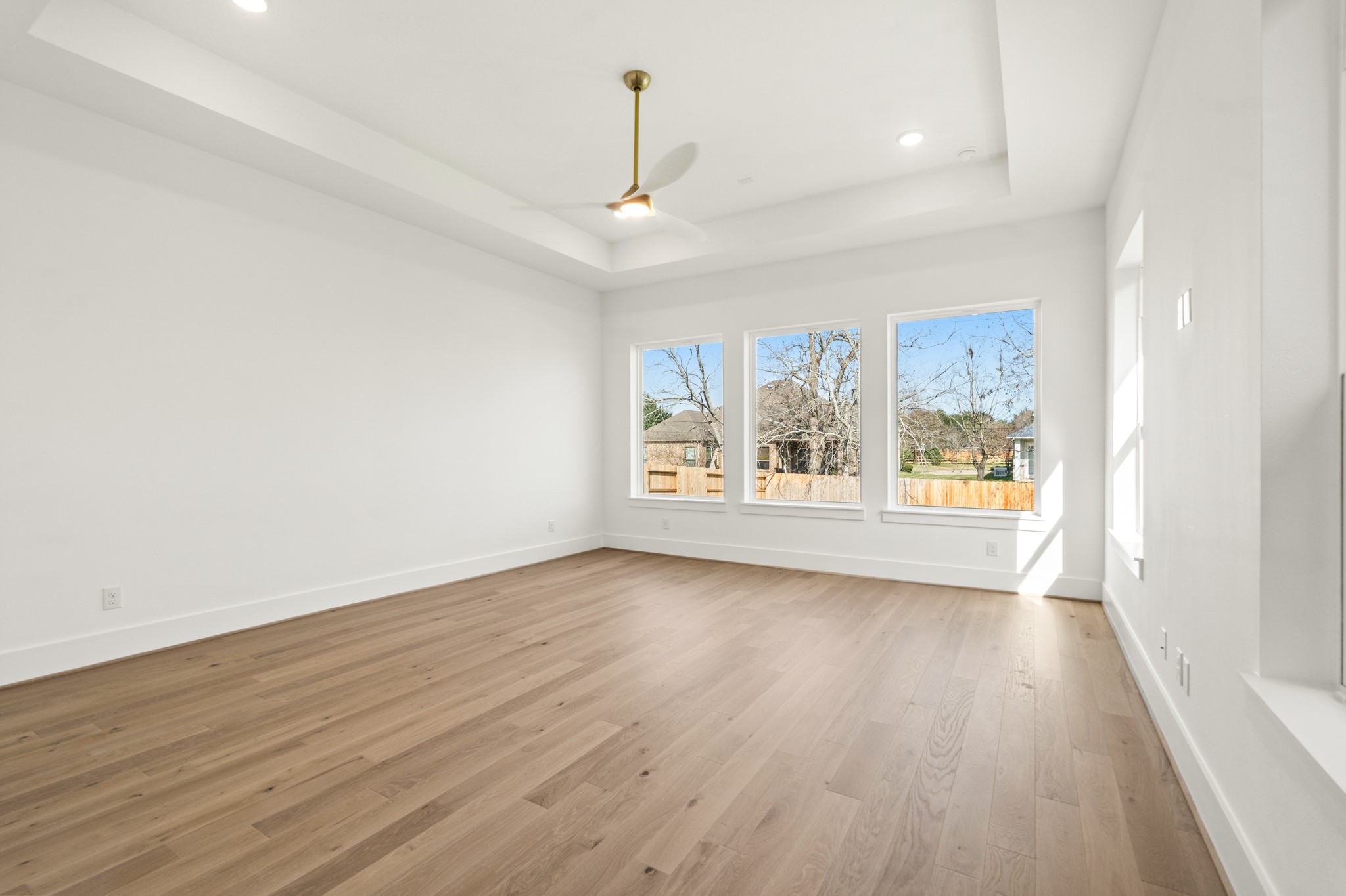4210 Westgate Lane Fulshear, TX 77441 - Photo 14 of 48 wooden floor in an empty room with a window