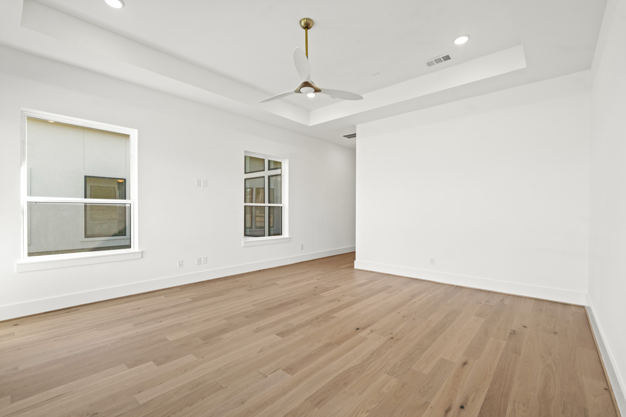 4210 Westgate Lane Fulshear, TX 77441 - Photo 15 of 48 wooden floor in an empty room with a window