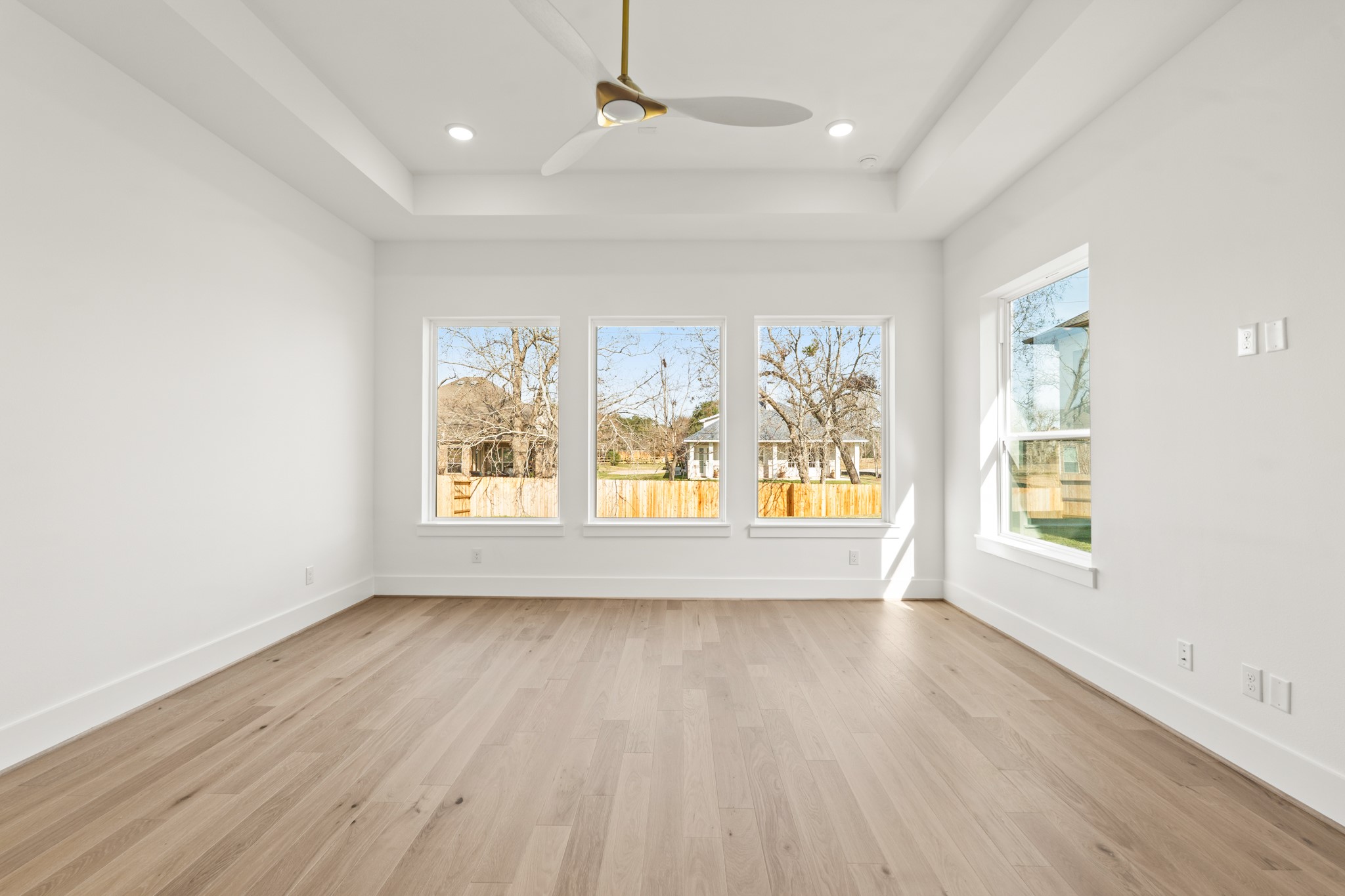 4210 Westgate Lane Fulshear, TX 77441 - Photo 22 of 48 wooden floor in an empty room with a window
