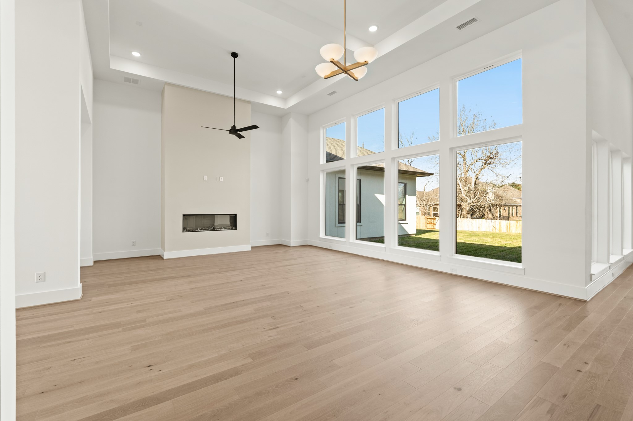 4210 Westgate Lane Fulshear, TX 77441 - Photo 24 of 48 a view of an empty room with a window and wooden floor