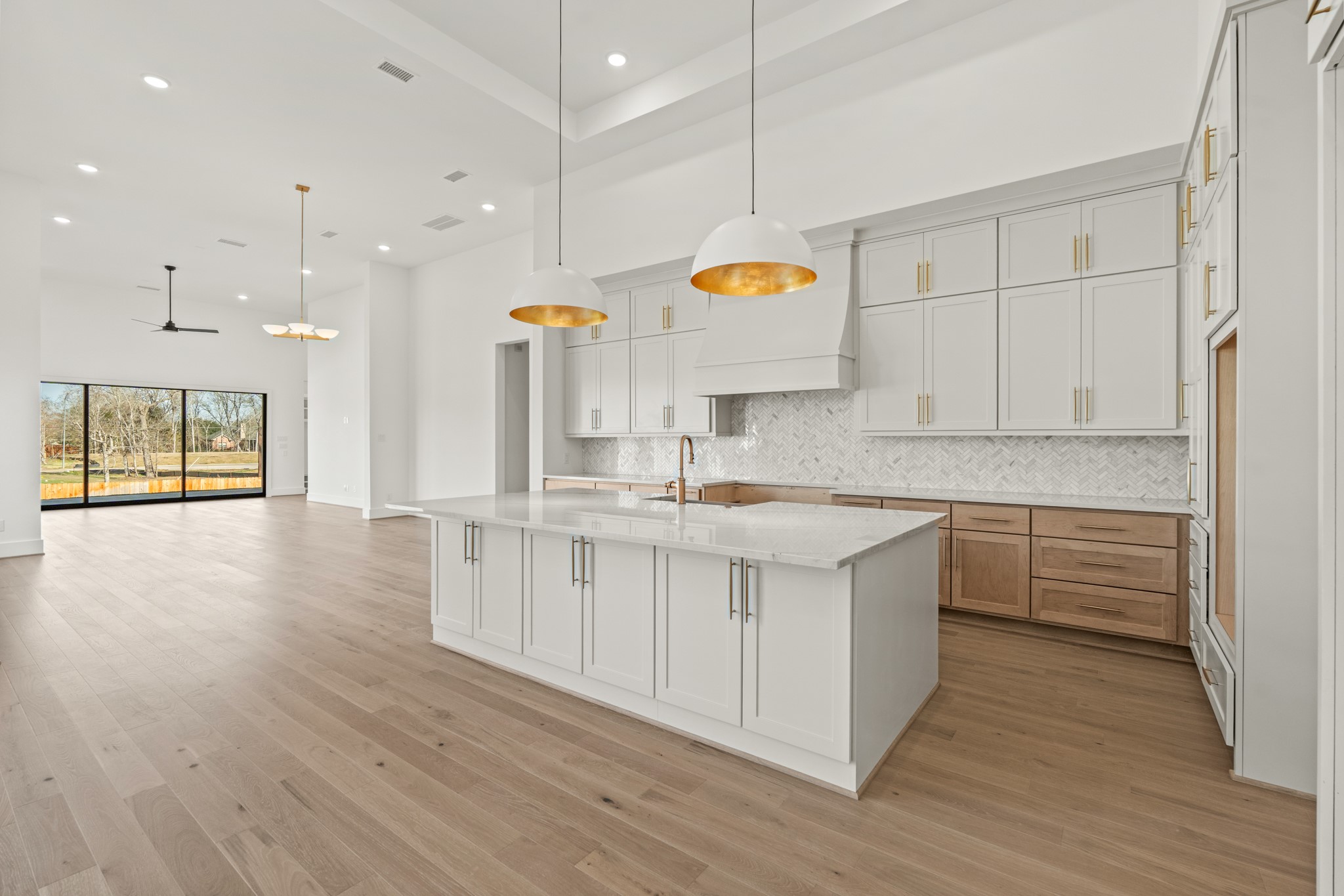 4210 Westgate Lane Fulshear, TX 77441 - Photo 30 of 48 a kitchen with stainless steel appliances granite countertop a sink a stove and a wooden floors