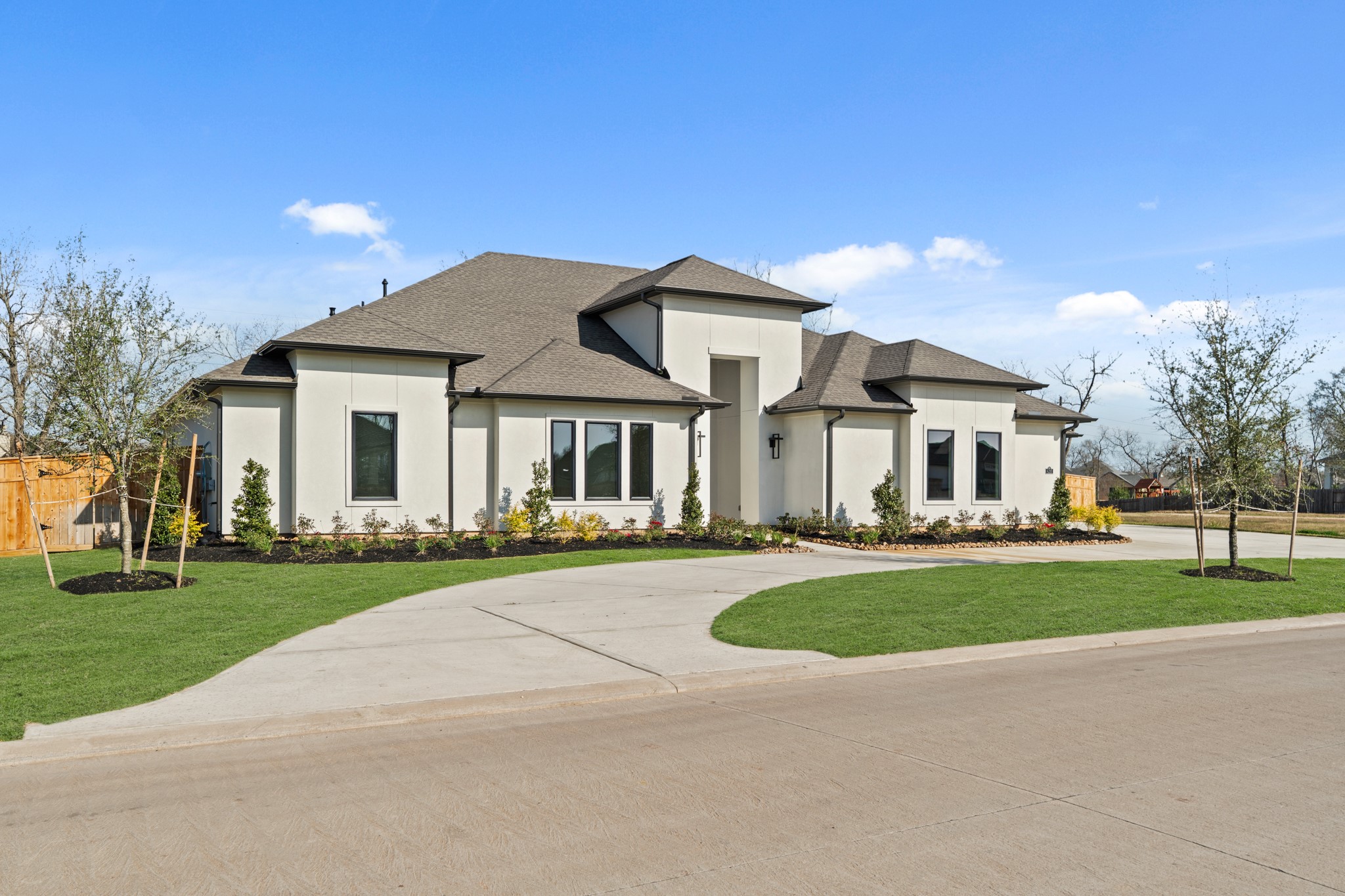 4210 Westgate Lane Fulshear, TX 77441 - Photo 3 of 48 a front view of a house with a garden