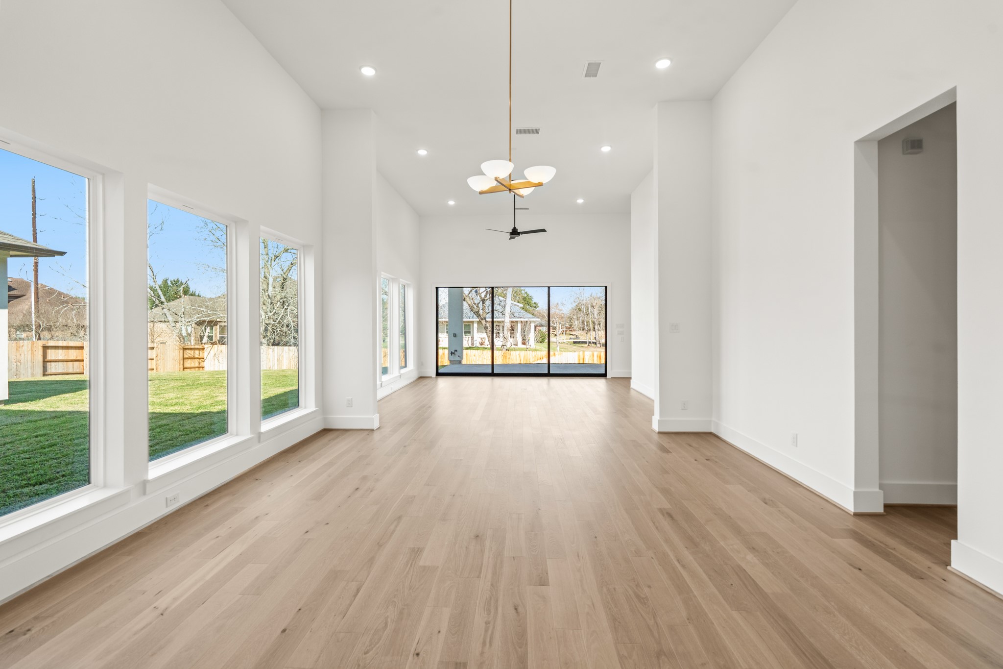 4210 Westgate Lane Fulshear, TX 77441 - Photo 34 of 48 a view of an empty room with wooden floor and a window
