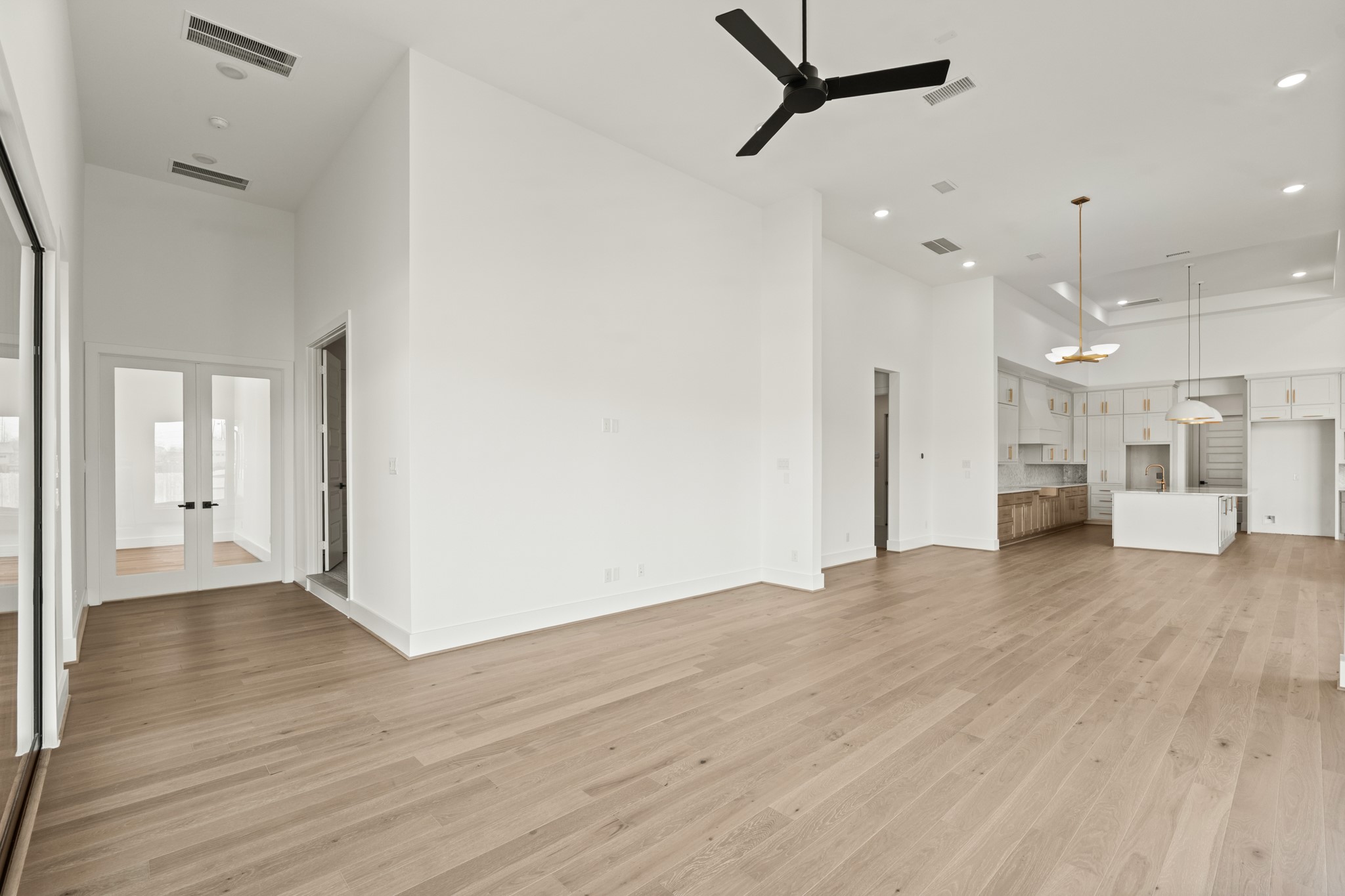 4210 Westgate Lane Fulshear, TX 77441 - Photo 37 of 48 a view of a big room with wooden floor and a window