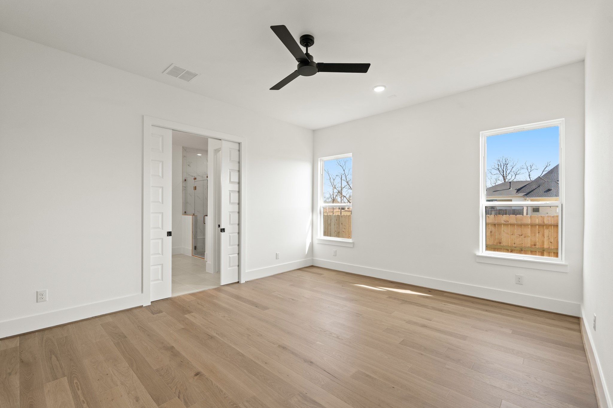 4210 Westgate Lane Fulshear, TX 77441 - Photo 42 of 48 a view of empty room with wooden floor and fan