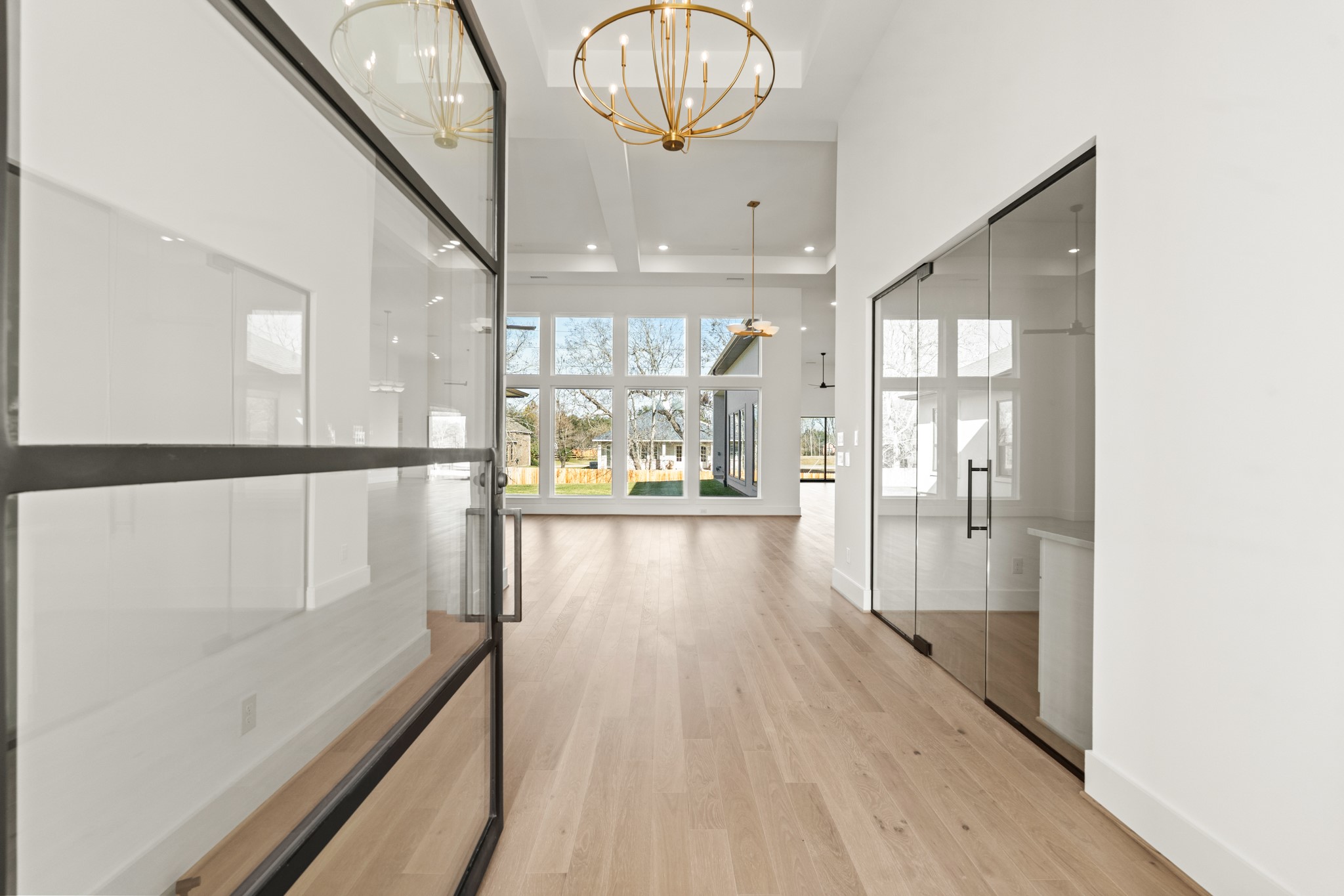 4210 Westgate Lane Fulshear, TX 77441 - Photo 5 of 48 a view of a hallway with wooden floor