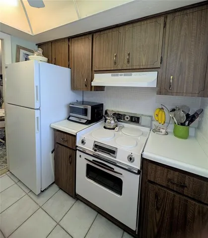 a spacious bedroom with a bed and a window