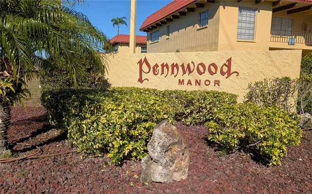 a view of outdoor space with signage and flags