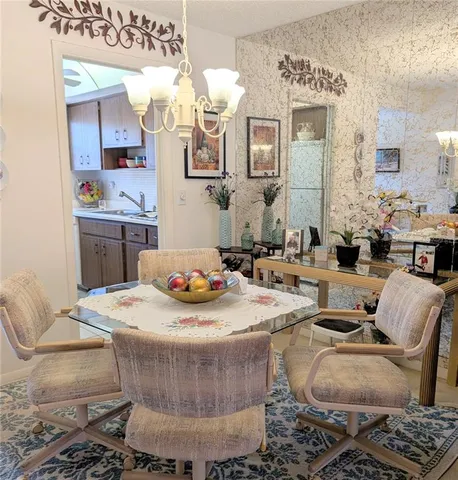 a living room with fireplace furniture and a fireplace