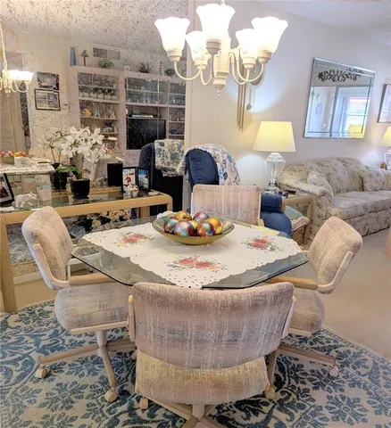 a kitchen with stainless steel appliances a refrigerator sink and cabinets