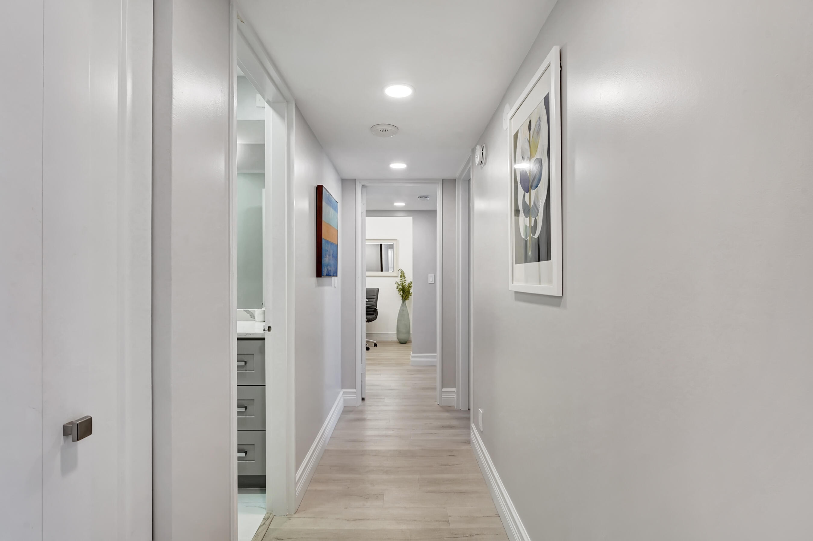 2175 South Ocean Boulevard, Unit 304 Delray Beach, FL 33483 - Photo 11 of 28 a view of a hallway with wooden floor