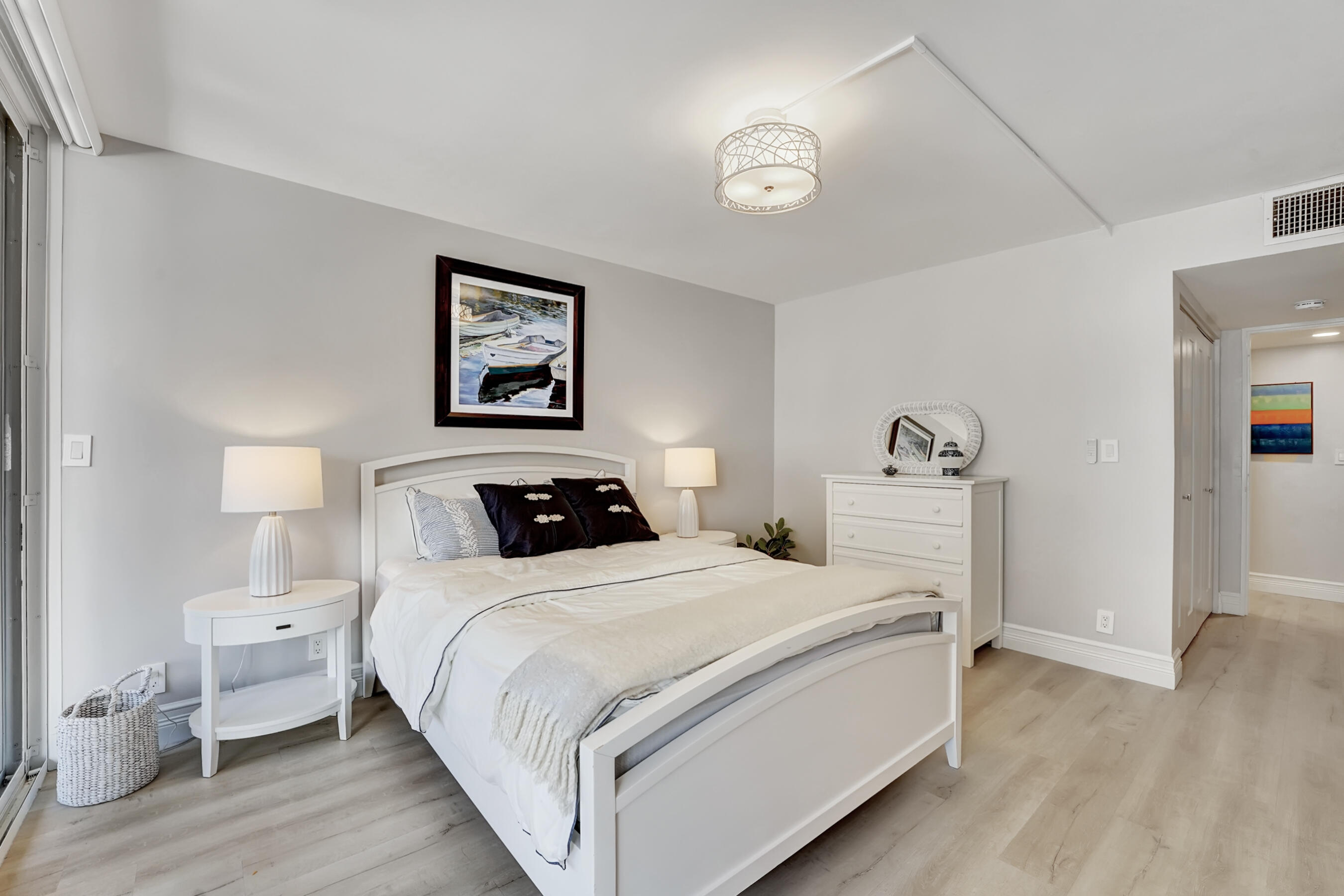 2175 South Ocean Boulevard, Unit 304 Delray Beach, FL 33483 - Photo 20 of 28 a bedroom with bed and a view of bedroom