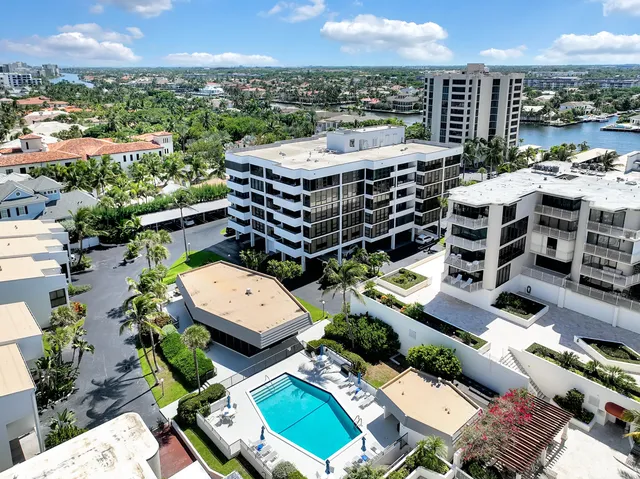 a view of a swimming pool with outdoor seating