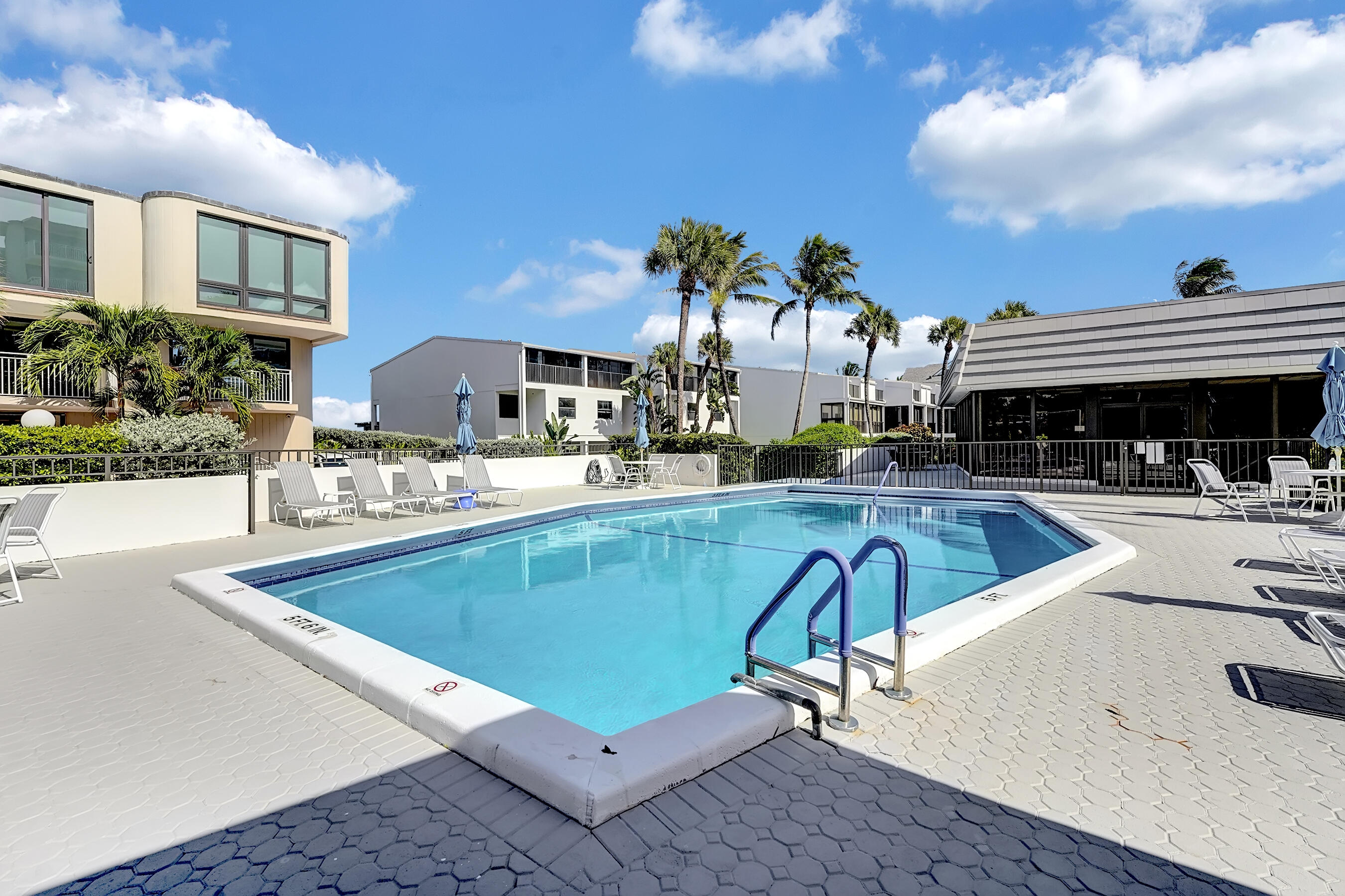 2175 South Ocean Boulevard, Unit 304 Delray Beach, FL 33483 - Photo 26 of 28 a view of a swimming pool with outdoor seating
