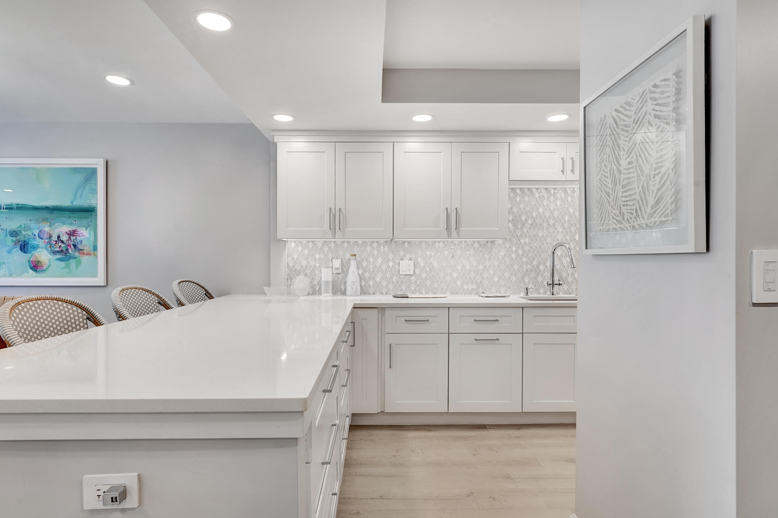 2175 South Ocean Boulevard, Unit 304 Delray Beach, FL 33483 - Photo 3 of 28 a kitchen with a sink cabinets and window