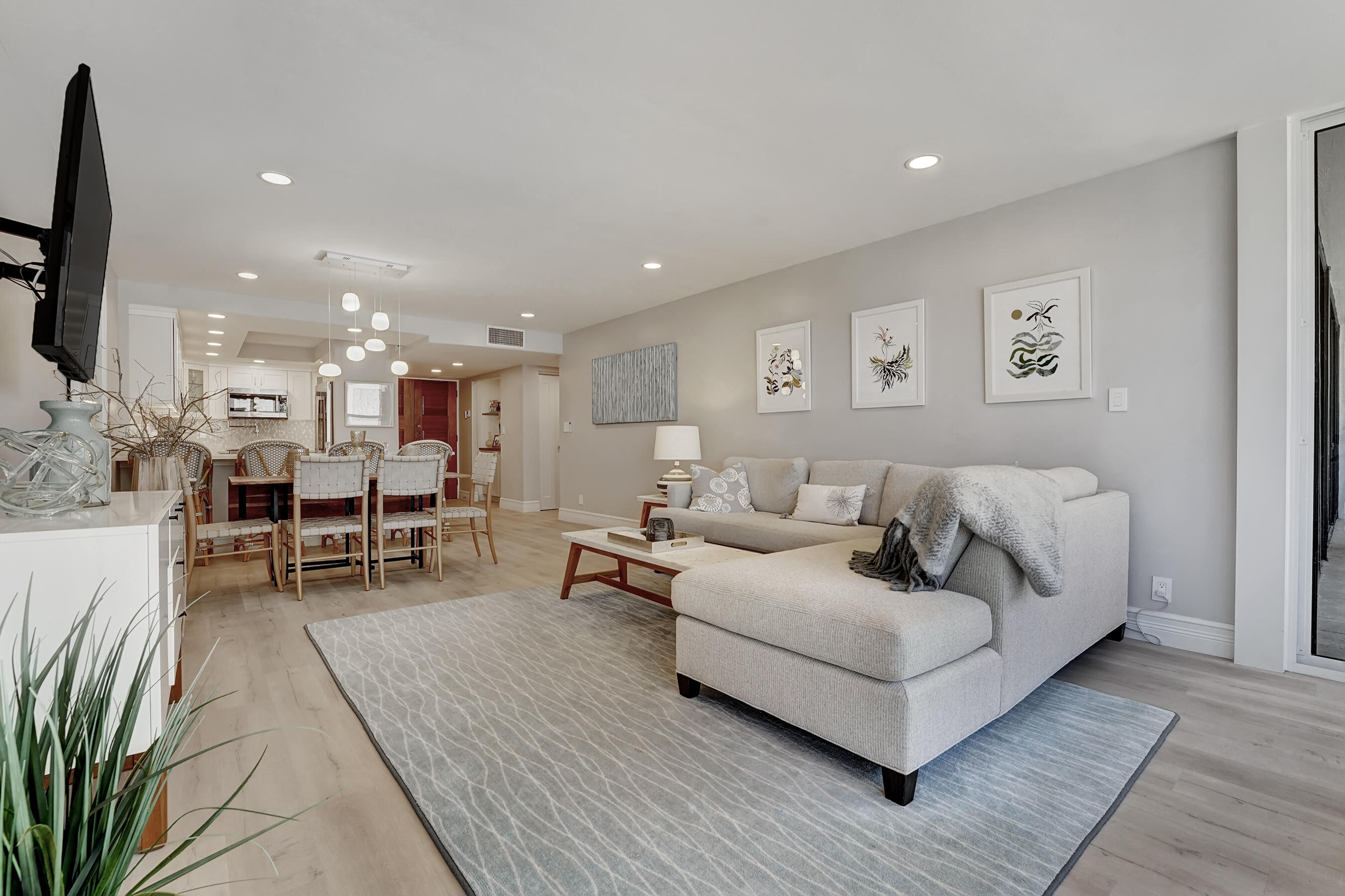 2175 South Ocean Boulevard, Unit 304 Delray Beach, FL 33483 - Photo 8 of 28 a living room with furniture and wooden floor
